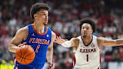 Mar 5, 2025; Tuscaloosa, Alabama, USA; Florida Gators guard Walter Clayton Jr. (1) drives the ball against Alabama Crimson Tide guard Mark Sears (1) during the first half at Coleman Coliseum. Mandatory Credit: Will McLelland-Imagn Images