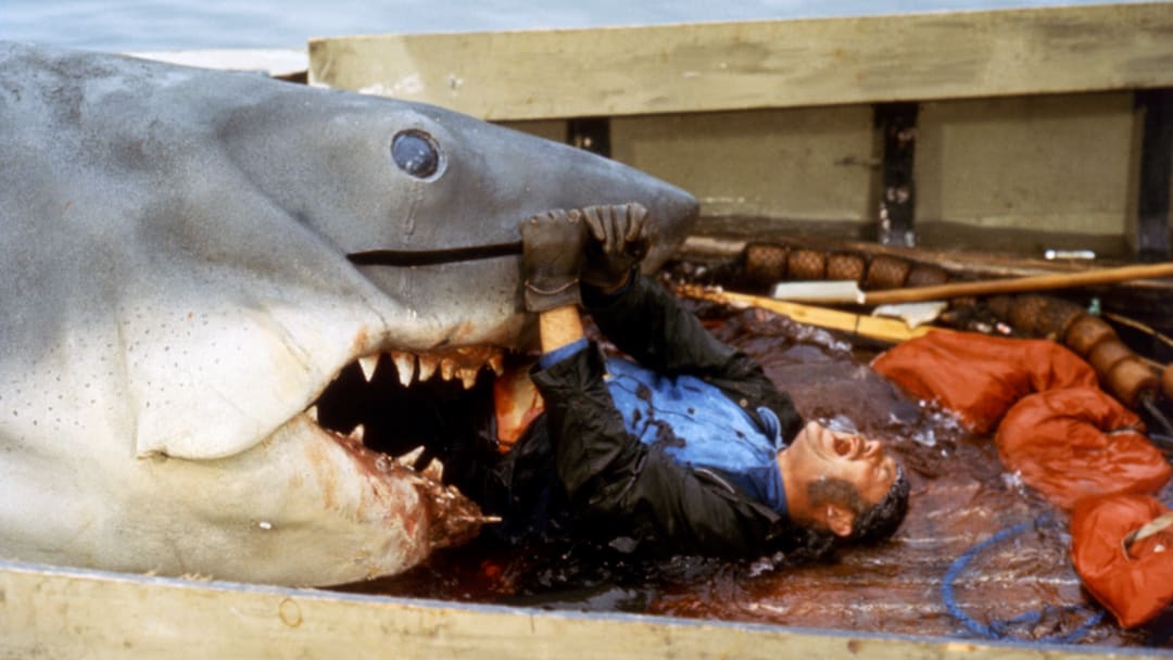 Bruce snacks on actor Robert Shaw on the set of ‘Jaws.’ Bruce snacks on actor Robert Shaw on the set of ‘Jaws.’