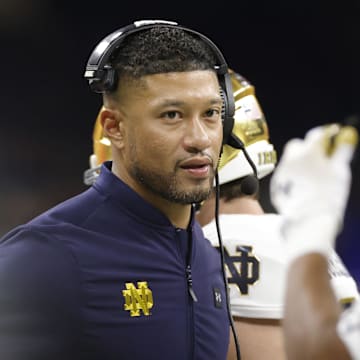 Jan 2, 2025; New Orleans, LA, USA; Notre Dame Fighting Irish head coach Marcus Freeman looks on from the sidelines against the Georgia Bulldogs during the first half at Caesars Superdome. 