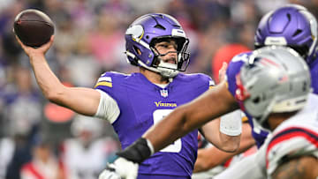 Minnesota Vikings quarterback Sam Howell (8) throws a pass against the New England Patriots during the first quarter