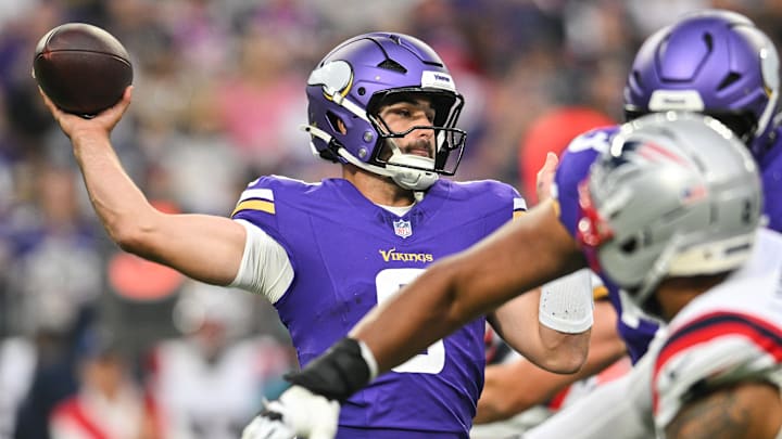 Minnesota Vikings quarterback Sam Howell (8) throws a pass against the New England Patriots during the first quarter Minnesota Vikings quarterback Sam Howell (8) throws a pass against the New England Patriots during the first quarter