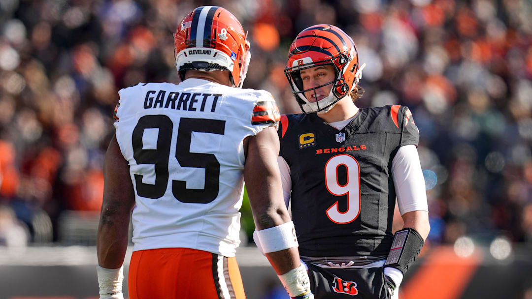 Jan 4, 2026; Cincinnati, Ohio, USA; Cincinnati Bengals quarterback Joe Burrow (9) and Cleveland Browns defensive end Myles Garrett (95) talk between plays in the first quarter at Paycor Stadium. Mandatory Credit: Sam Greene-USA TODAY Network via Imagn Images