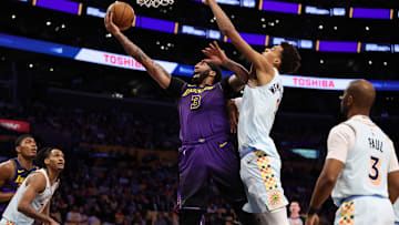 Jan 13, 2025; Los Angeles, California, USA;  Los Angeles Lakers forward Anthony Davis (3) goes to the basket against San Antonio Spurs center Victor Wembanyama (1) during the first quarter at Crypto.com Arena. Mandatory Credit: Kiyoshi Mio-Imagn Images