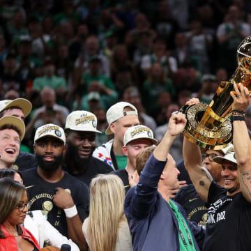 Jun 17, 2024; Boston, Massachusetts, USA; Boston Celtics head coach Joe Mazzulla holds up the trophy as he celebrates after winning the 2024 NBA Finals against the Dallas Mavericks at TD Garden. Mandatory Credit: Peter Casey-USA TODAY Sports