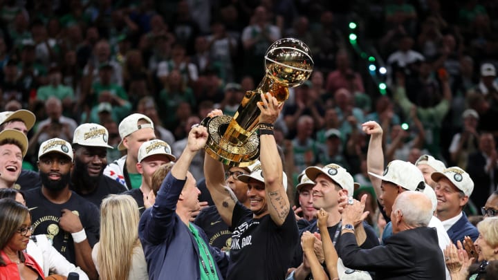 Jun 17, 2024; Boston, Massachusetts, USA; Boston Celtics head coach Joe Mazzulla holds up the trophy as he celebrates after winning the 2024 NBA Finals against the Dallas Mavericks at TD Garden. Mandatory Credit: Peter Casey-USA TODAY Sports