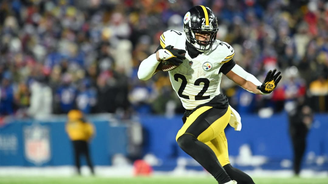 Jan 15, 2024; Orchard Park, New York, USA; Pittsburgh Steelers running back Najee Harris (22) runs the ball in the first half against the Buffalo Bills in a 2024 AFC wild card game at Highmark Stadium. Mandatory Credit: Mark Konezny-USA TODAY Sports