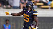 Oct 26, 2024; Berkeley, California, USA; California Golden Bears running back Jaivian Thomas (25) reacts after scoring a touchdown against the Oregon State Beavers during the second quarter at California Memorial Stadium.  Thomas was ruled down before the end zone after a video review. Mandatory Credit: Darren Yamashita-Imagn Images