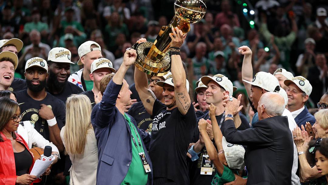 Jun 17, 2024; Boston, Massachusetts, USA; Boston Celtics head coach Joe Mazzulla holds up the trophy as he celebrates after winning the 2024 NBA Finals against the Dallas Mavericks at TD Garden. Mandatory Credit: Peter Casey-USA TODAY Sports