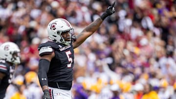 Sep 14, 2024; Columbia, South Carolina, USA; South Carolina Gamecocks edge Kyle Kennard (5) celebrates after a fourth down stop against the LSU Tigers in the third quarter at Williams-Brice Stadium. Mandatory Credit: Scott Kinser-Imagn Images