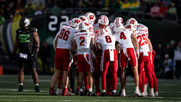Wisconsin huddles as the Oregon Ducks host the Wisconsin Badgers on Oct. 25, 2025, at Autzen Stadium in Eugene, Oregon.