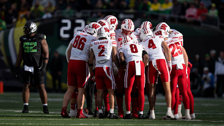 Wisconsin huddles as the Oregon Ducks host the Wisconsin Badgers on Oct. 25, 2025, at Autzen Stadium in Eugene, Oregon.