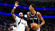 Oct 22, 2025; Dallas, Texas, USA;   San Antonio Spurs forward Victor Wembanyama (1) looks to shoot Dallas Mavericks forward Anthony Davis (3) defends during the second half at American Airlines Center. Mandatory Credit: Kevin Jairaj-Imagn Images