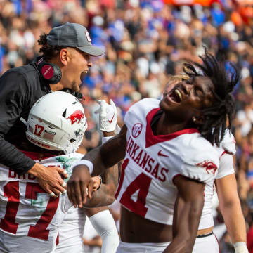 Arkansas Razorbacks wide receiver Tyrone Broden (17) is congratulated by teammates and coaches after catching the game winning over-time touchdown at Steve Spurrier Field at Ben Hill Griffin Stadium in Gainesville, FL on Saturday, November 4, 2023 in the second half. Arkansas defeated Florida 39-36 in over-time. [Doug Engle/Gainesville Sun]