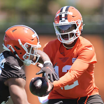 May 10, 2025; Berea, OH, USA; Cleveland Browns quarterback Shedeur Sanders (12) hands off during rookie minicamp at CrossCountry Mortgage Campus. Mandatory Credit: Ken Blaze-Imagn Images