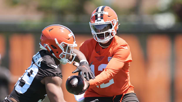 May 10, 2025; Berea, OH, USA; Cleveland Browns quarterback Shedeur Sanders (12) hands off during rookie minicamp at CrossCoun