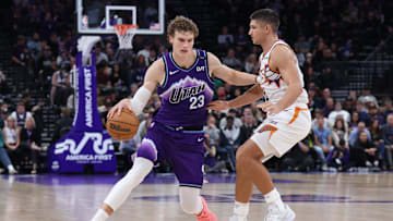 Oct 27, 2025; Salt Lake City, Utah, USA; Utah Jazz forward Lauri Markkanen (23) dribbles against Phoenix Suns guard Grayson Allen (8) during overtime at Delta Center. Mandatory Credit: Rob Gray-Imagn Images