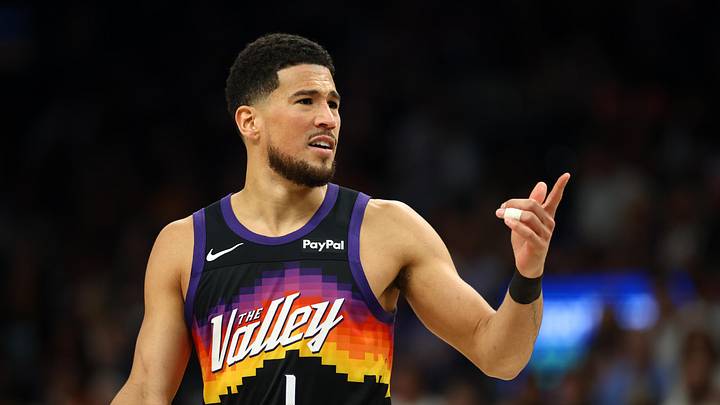 Apr 8, 2026; Phoenix, Arizona, USA; Phoenix Suns guard Devin Booker (1) against the Dallas Mavericks at Mortgage Matchup Center. Mandatory Credit: Mark J. Rebilas-Imagn Images
