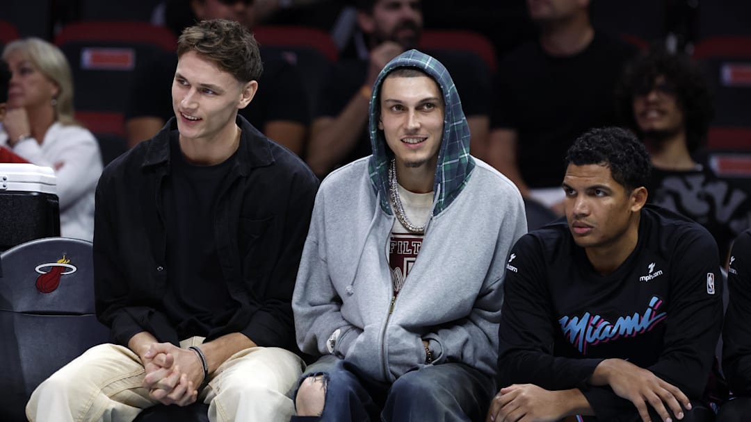 Dec 6, 2025; Miami, Florida, USA; Miami Heat guard Pelle Larsson, left, guard Tyler Herro, center, and guard Dru Smith, right, sit on the bench against the Sacramento Kings during the second half at Kaseya Center. Mandatory Credit: Rhona Wise-Imagn Images Dec 6, 2025; Miami, Florida, USA; Miami Heat guard Pelle Larsson, left, guard Tyler Herro, center, and guard Dru Smith, right, sit on the bench against the Sacramento Kings during the second half at Kaseya Center. Mandatory Credit: Rhona Wise-Imagn Images