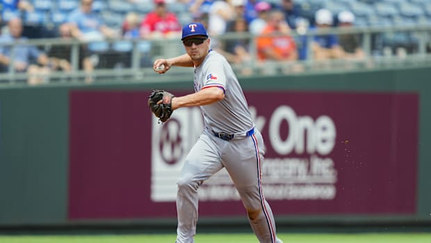 Texas Rangers shortstop Corey Seager (5) throws to first base during the first inning against the Kansas City Royals.