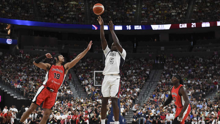 Jul 10, 2024; Las Vegas, Nevada, USA; USA guard Anthony Edwards (5) shoots over Canada guard Andrew Nembhard (19) in the second quarter of the USA Basketball Showcase at T-Mobile Arena. Mandatory Credit: Candice Ward-USA TODAY Sports