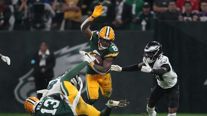 Sep 6, 2024; Sao Paulo, BRA; Green Bay Packers running back Josh Jacobs (8) runs against Philadelphia Eagles safety C.J. Gardner-Johnson (8) and cornerback Quinyon Mitchell (27) during the second half at Neo Quimica Arena. Kirby Lee-Imagn Images