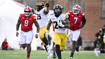 Nov 23, 2024; College Park, Maryland, USA;  Iowa Hawkeyes running back Kamari Moulton (28) runs for a touchdown during the second  half against the Maryland Terrapins at SECU Stadium. Mandatory Credit: Tommy Gilligan-Imagn Images