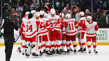 Feb 4, 2025; Seattle, Washington, USA; The Detroit Red Wings celebrate defeating the Seattle Kraken at Climate Pledge Arena. Mandatory Credit: Steven Bisig-Imagn Images