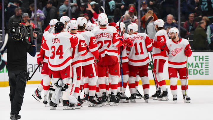 Feb 4, 2025; Seattle, Washington, USA; The Detroit Red Wings celebrate defeating the Seattle Kraken at Climate Pledge Arena. Mandatory Credit: Steven Bisig-Imagn Images