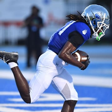 IMG Academy wide receiver Adonis Moise (#17) scores after making a one-handed catch. The IMG Academy National squad hosted the Cocoa High School Tigers Friday, Sept. 6, 2024 in Bradenton.