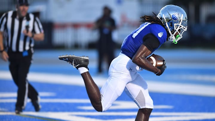 IMG Academy wide receiver Adonis Moise (#17) scores after making a one-handed catch. The IMG Academy National squad hosted the Cocoa High School Tigers Friday, Sept. 6, 2024 in Bradenton.