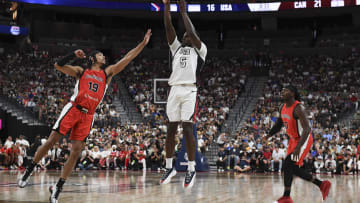 Jul 10, 2024; Las Vegas, Nevada, USA; USA guard Anthony Edwards (5) shoots over Canada guard Andrew Nembhard (19) in the second quarter of the USA Basketball Showcase at T-Mobile Arena. Mandatory Credit: Candice Ward-USA TODAY Sports
