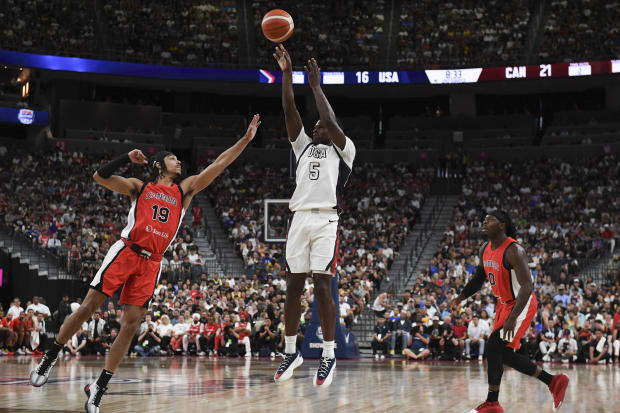 USA guard Anthony Edwards shoots a three-pointer.