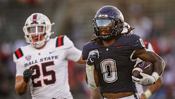 Sep 20, 2025; East Hartford, Connecticut, USA; Connecticut Huskies running back Cam Edwards (0) runs the ball for a touchdown against the Ball State Cardinals in the second half at Pratt & Whitney Stadium at Rentschler Field. Mandatory Credit: David Butler II-Imagn Images