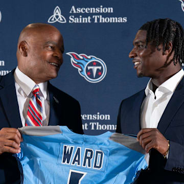 NFL Hall of Fame quarterback Warren Moon, left, poses for pictures with Cam Ward who earlier had been introduced as the Tennessee Titans first-round pick – and overall number one pick – in the NFL Draft at Ascension Saint Thomas Sports Park in Nashville, Tenn., Friday, April 25, 2025. Moon, whose No. 1 jersey is retired for the Tennessee Titans, allowed Ward to wear his number.