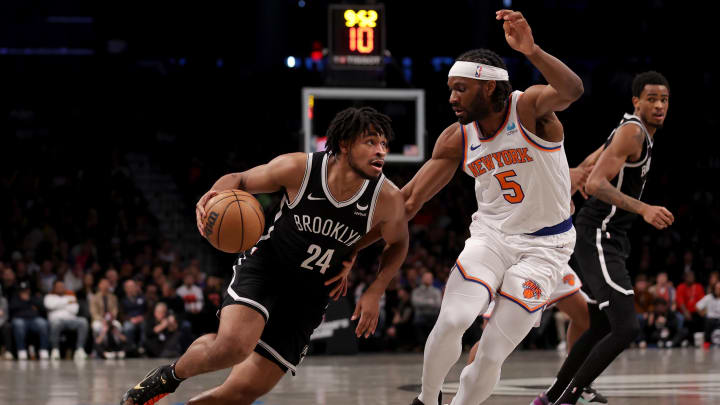 Jan 23, 2024; Brooklyn, New York, USA; Brooklyn Nets guard Cam Thomas (24) drives to the basket against New York Knicks forward Precious Achiuwa (5) during the fourth quarter at Barclays Center. Mandatory Credit: Brad Penner-USA TODAY Sports