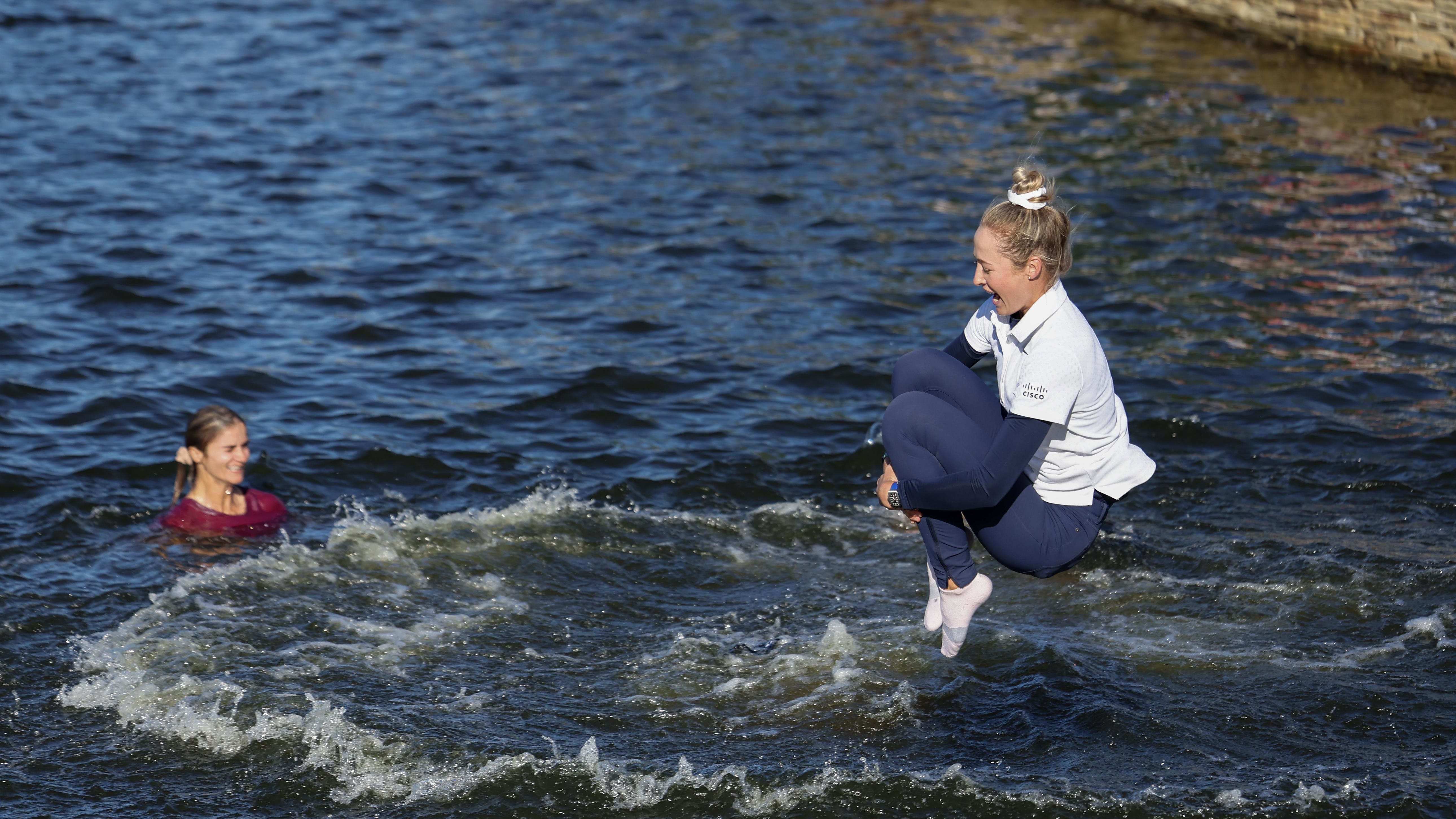 Nelly Korda jumps in the pond next to the 18th after winning the 2024 Chevron Championship.