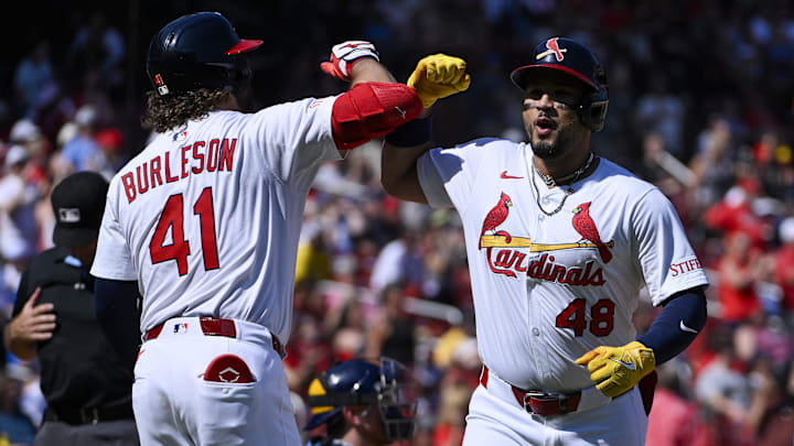 Sep 21, 2025; St. Louis, Missouri, USA; St. Louis Cardinals designated hitter Ivan Herrera (48) celebrates with first baseman Alec Burleson (41) after hitting a two run home run against the Milwaukee Brewers during the third inning at Busch Stadium. Mandatory Credit: Jeff Curry-Imagn Images