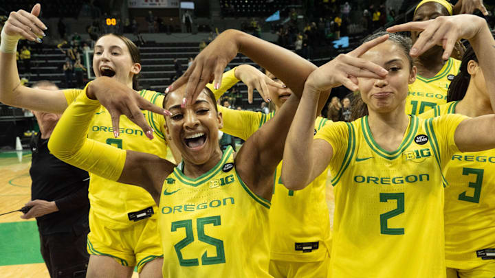 Oregon’s Elisa Mevius, left, Deja Kelly and Katie Fiso celebrate with teammates after defeating Washington at Matthew Knight Arena Wednesday, Feb. 12, 2025. Oregon’s Elisa Mevius, left, Deja Kelly and Katie Fiso celebrate with teammates after defeating Washington at Matthew Knight Arena Wednesday, Feb. 12, 2025.