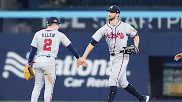 Apr 14, 2025; Toronto, Ontario, CAN; Atlanta Braves left fielder Eli White (36) celebrates the win with shortstop Nick Allen (2) against the Toronto Blue Jays at the end of the ninth inning at Rogers Centre. Mandatory Credit: Nick Turchiaro-Imagn Images