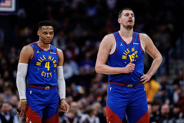 Denver Nuggets guard Russell Westbrook (4) and center Nikola Jokic (15) Denver Nuggets guard Russell Westbrook (4) and center Nikola Jokic (15)