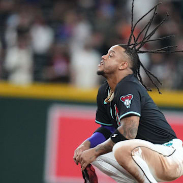 Arizona Diamondbacks infielder Ketel Marte (4) flips his hair as he waits for play to resume against the San Francisco Giants at Chase Field on June 30, 2025.