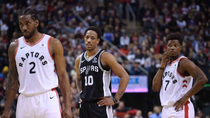 Feb 22, 2019; Toronto, Ontario, CAN; Toronto Raptors forward Kawhi Leonard (2) and San Antonio Spurs guard DeMar DeRozan (10) and Toronto Raptors guard Kyle Lowry (7) at Scotiabank Arena. 