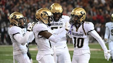 Nov 17, 2023; Pullman, Washington, USA; Colorado Buffaloes wide receiver Travis Hunter, center, celebrates a touchdown with Colorado Buffaloes wide receiver Xavier Weaver (10) during a game against the Washington State Cougars in the first half at Gesa Field at Martin Stadium.