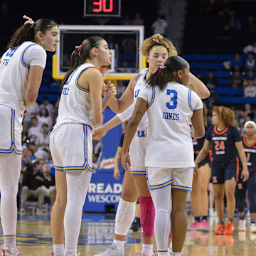 Feb 20, 2025; Los Angeles, California, USA; UCLA Bruins head coach Cori Close talks to her players center Lauren Betts (51), guard Gabriela Jaquez (11), guard Kiki Rice (1) and guard Londynn Jones (3) during the fourth quarter at Pauley Pavilion presented by Wescom. Mandatory Credit: Robert Hanashiro-Imagn Images