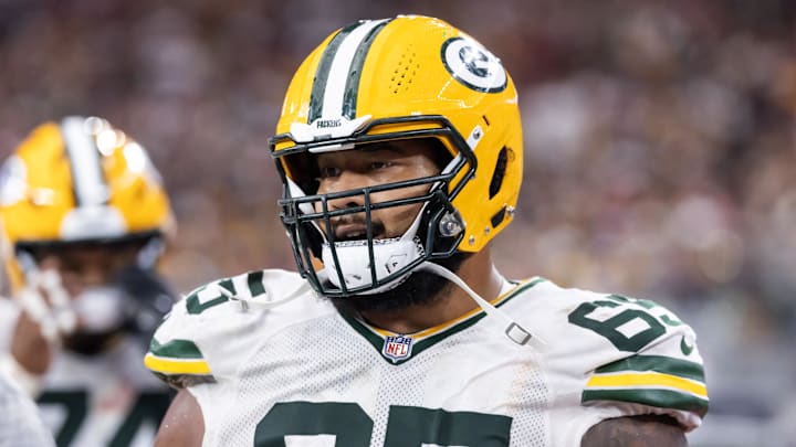 Oct 19, 2025; Glendale, Arizona, USA; Green Bay Packers guard Aaron Banks (65) against the Arizona Cardinals at State Farm Stadium. Mandatory Credit: Mark J. Rebilas-Imagn Images