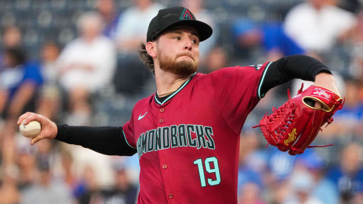 Jul 24, 2024; Kansas City, Missouri, USA; Arizona Diamondbacks starting pitcher Ryne Nelson (19) delivers a pitch against the Kansas City Royals in the first inning at Kauffman Stadium. Mandatory Credit: Denny Medley-USA TODAY Sports