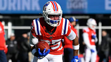 Dec 1, 2024; Foxborough, Massachusetts, USA; New England Patriots cornerback Marcus Jones (25) warms up before a game against the Indianapolis Colts at Gillette Stadium. Mandatory Credit: Eric Canha-Imagn Images