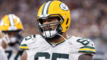 Oct 19, 2025; Glendale, Arizona, USA; Green Bay Packers guard Aaron Banks (65) against the Arizona Cardinals at State Farm Stadium.