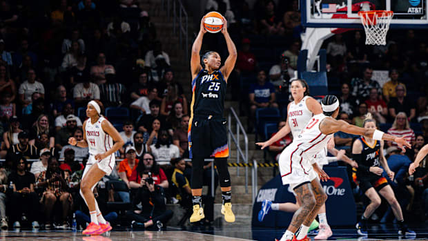 A photo of Alyssa Thomas getting a reboun