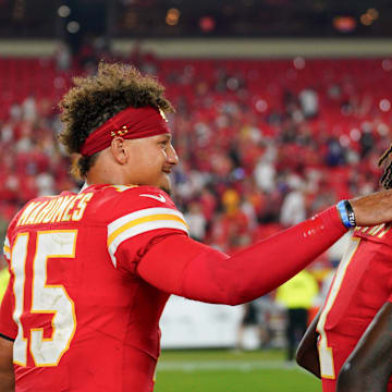 Sep 5, 2024; Kansas City, Missouri, USA; Kansas City Chiefs quarterback Patrick Mahomes (15) celebrates with wide receiver Xavier Worthy (1) after the win over the Baltimore Ravens at GEHA Field at Arrowhead Stadium. Mandatory Credit: Denny Medley-Imagn Images